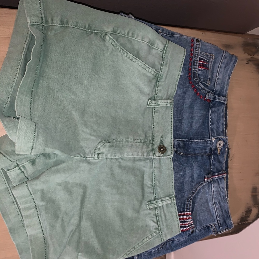 three pairs of jean shorts